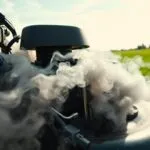 why does my lawn mower smoke